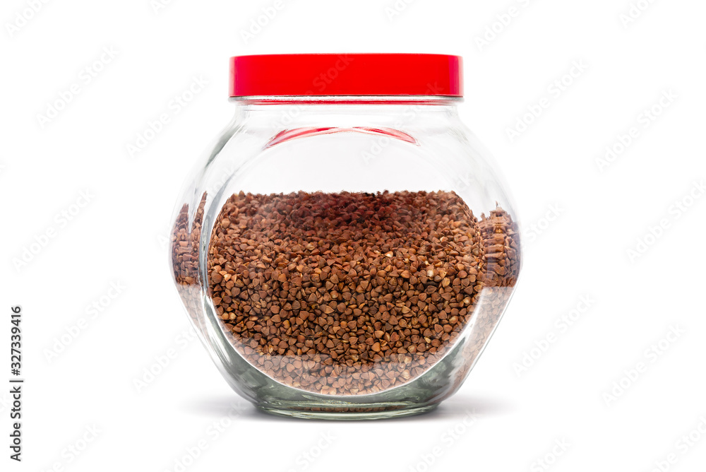 buckwheat in a glass jar on a white background buckwheat in a glass jar on a white background