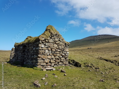 Grassroof house ocean stone wall faroe islands mykines