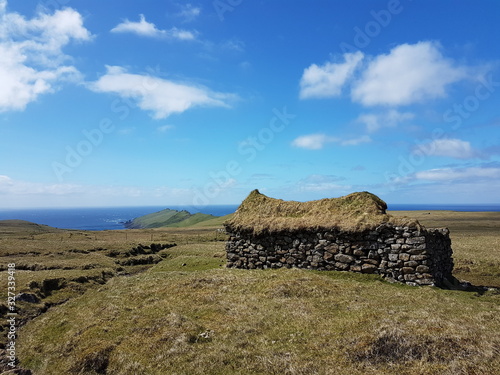 Grassroof house ocean stone wall faroe islands mykines