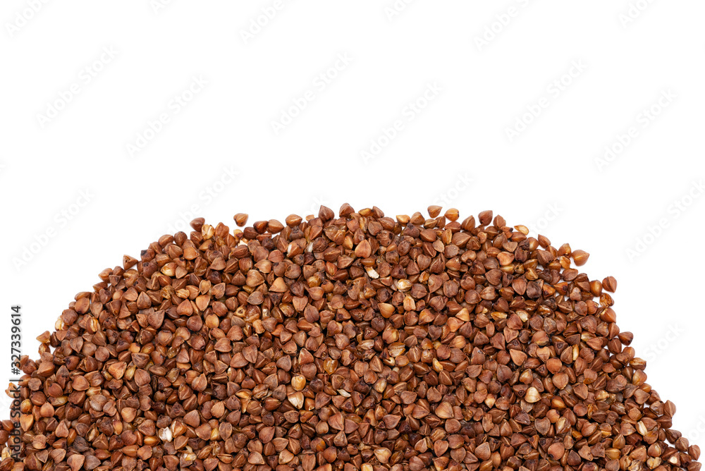 raw buckwheat groats on a white background raw buckwheat groats on a white background
