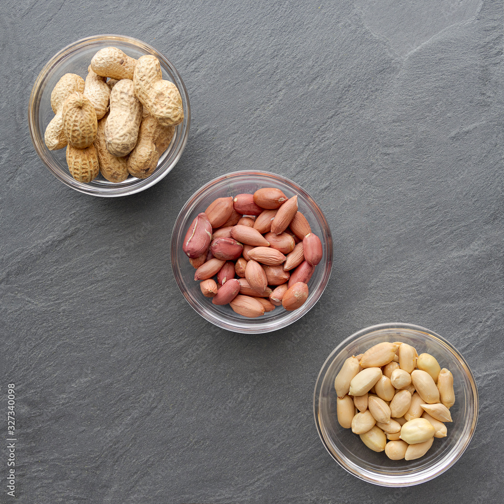 Top view of three bowls of peanuts, healthy snack Top view of three bowls of peanuts, healthy snack