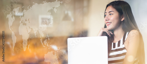 Konstfotografi Portrait of young Asian woman looking on the digital map for new opportunities to expand her business to around the world, Concept New chance and rethinking strategy on the wide screen and copy space