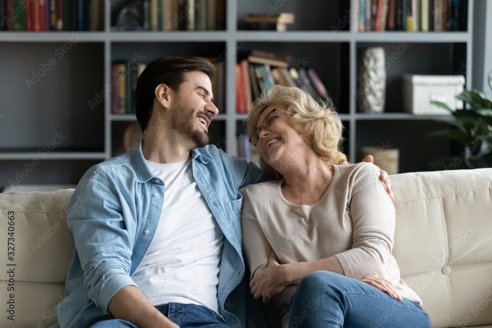 Happy mature mother relax having fun with adult son Happy mature mother relax having fun with adult son