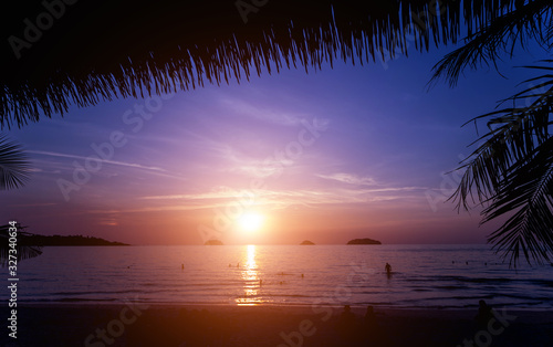 Beautiful sunset at the beach in the tropics. Sky and ocean © romaset