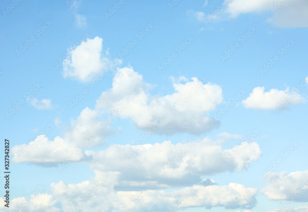 Picturesque view of blue sky with white clouds on sunny day Picturesque view of blue sky with white clouds on sunny day