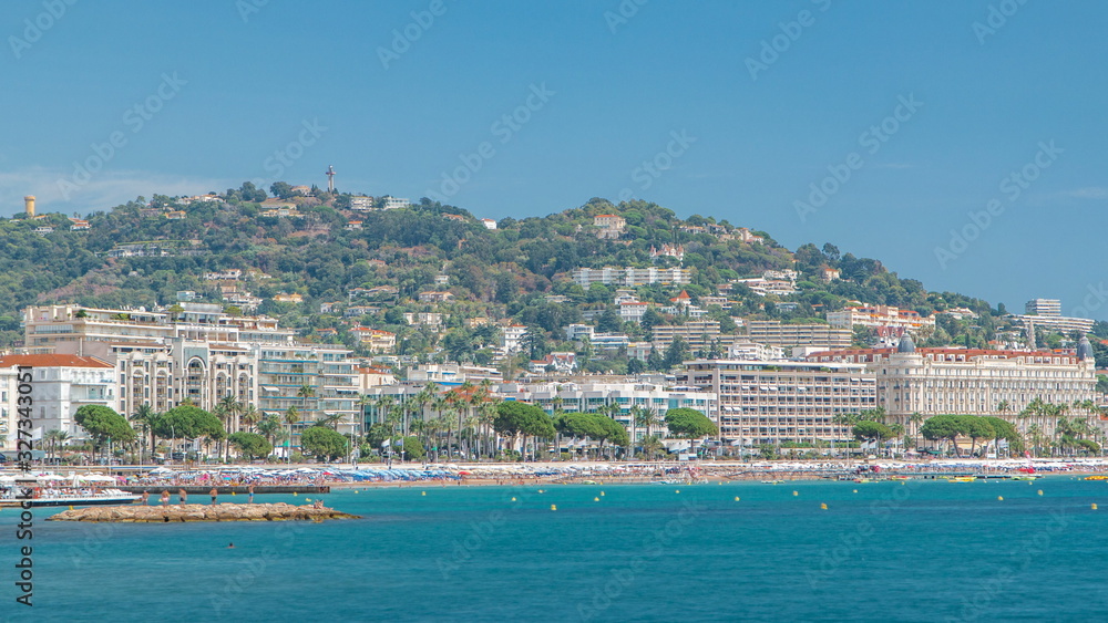 Colorful old town and beach in Cannes timelapse on french Riviera in a beautiful summer day, France