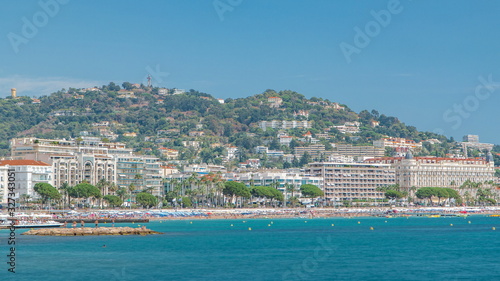 Colorful old town and beach in Cannes timelapse on french Riviera in a beautiful summer day, France © neiezhmakov