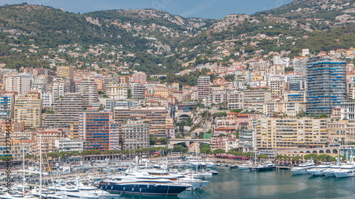 Monte Carlo city aerial panorama timelapse. View of luxury yachts and apartments in harbor of Monaco, Cote d'Azur.