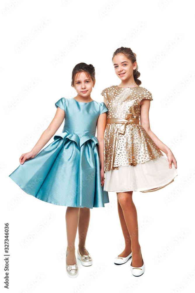 two girlfriends. portrait of girls in the studio. fashion shooting of children. two girlfriends. portrait of girls in the studio. fashion shooting of children.