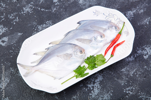 Delicious steamed sea pomfret photo