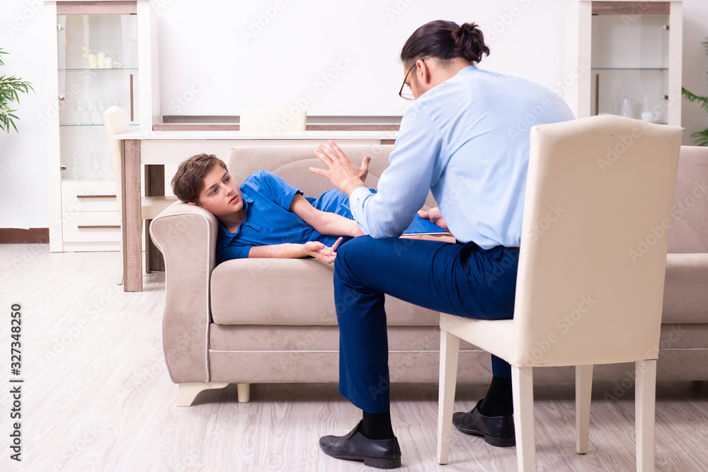 Internet addicted boy visiting male doctor Internet addicted boy visiting male doctor