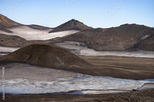 Volcanic landscape with snow, rocks and ash on the Fimmvorduhals hiking trail. Iceland