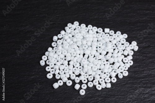 heap of matted tiny white glass beads for embroidery