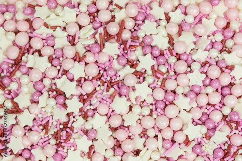 Fototapeta Naklejka Na Ścianę i Meble -  background of colorful sugar sprinkles in pink and white