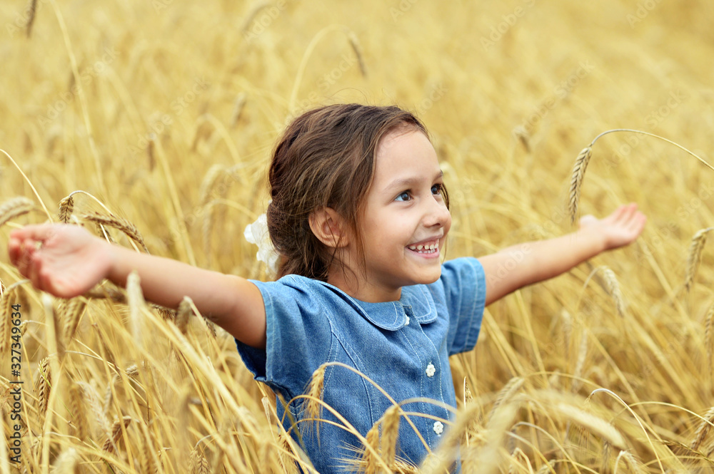 Portrait of cute little girl in wheat field Portrait of cute little girl in wheat field