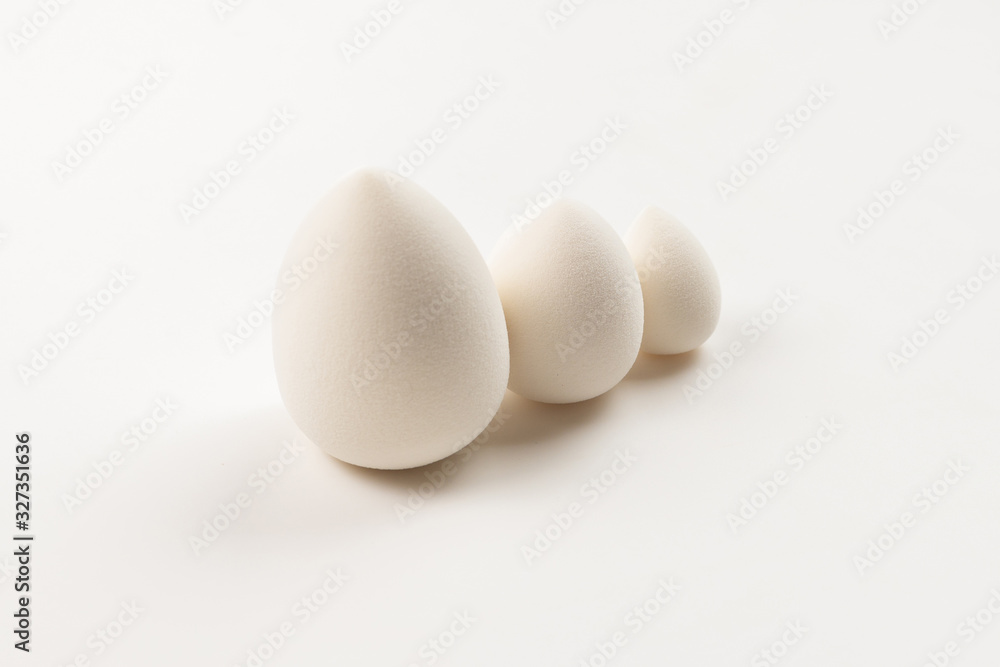Small, medium and large white beauty blender isolated. Small, medium and large white beauty blender isolated.
