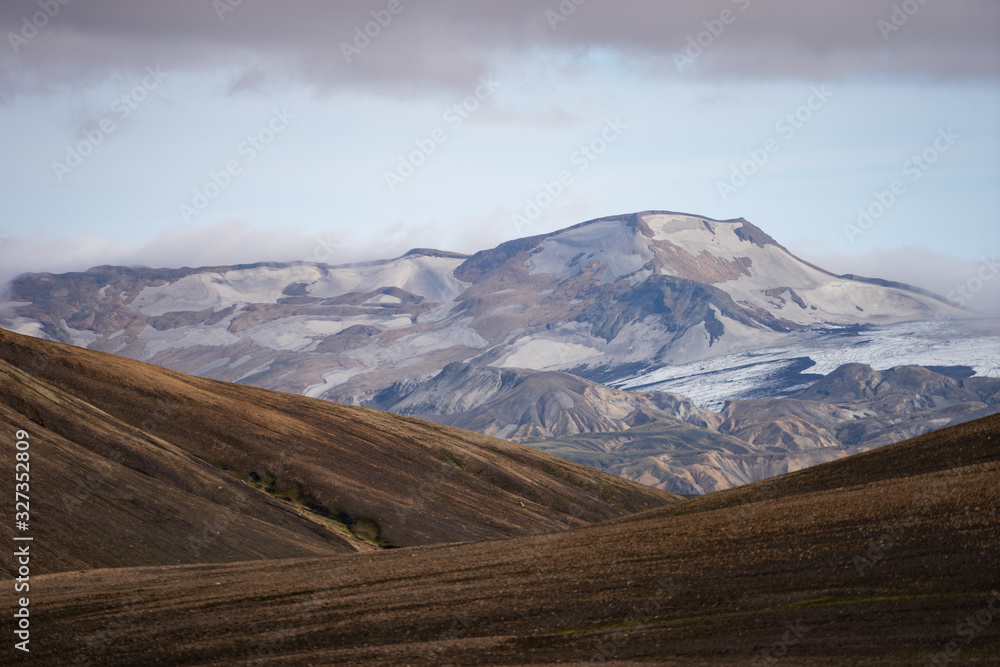 Beautiful landscape with glacier, hills and moss on the Fimmvorduhals trail near Landmannalaugar of summer sunny day, Iceland