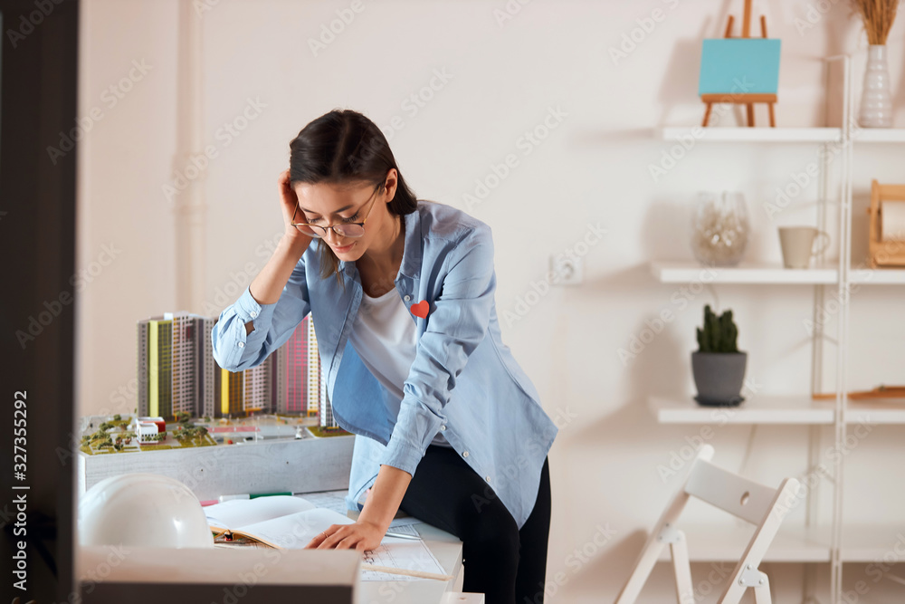 good looking serious girl is enthusiastic about a new project, brainstorming. close up photo. girl gets pleasure from planning a new object, good looking serious girl is enthusiastic about a new project, brainstorming. close up photo. girl gets pleasure from planning a new object,