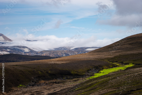 Beautiful landscape with glacier, hills and moss on the Fimmvorduhals trail near Landmannalaugar of summer sunny day, Iceland © Hladchenko Viktor