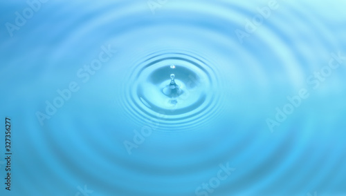 Water drop and circle ripple  light blue water  close up