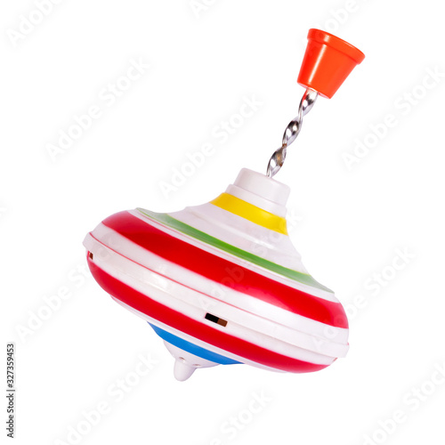 Fotografi Multicolored plastic spinning top or whirligig top is traditional toy for preschool childs