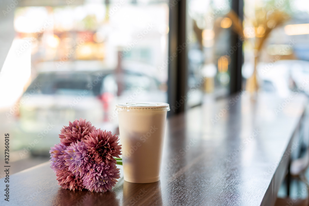 Coffee mugs paper and flowers placed beside the coffee shop Coffee mugs paper and flowers placed beside the coffee shop