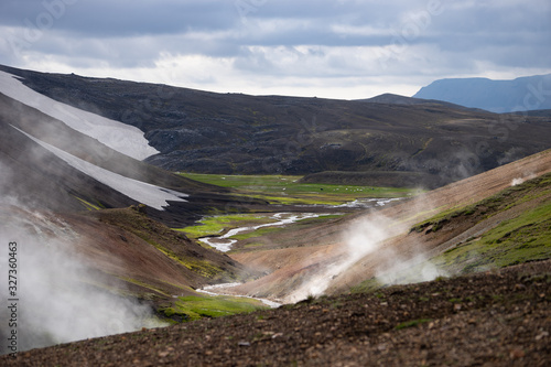 Volcanic active landscape with frog  glacier  hills and green moss on the Fimmvorduhals trail near Landmannalaugar of summer sunny day  Iceland