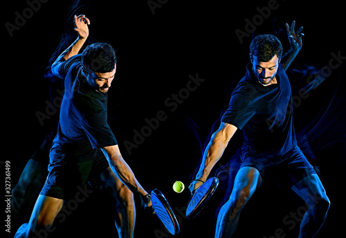 Paddle tennis player man light painting isolated black background © snaptitude