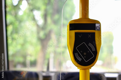 Tablou canvas Automatic validator for reading and scanning ticket, cards and bank cards in public transport to pay for riding