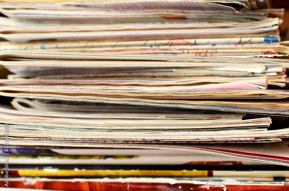 Extensive collection with a lot of glossy multi-colored magazines. Periodicals, official publication journalism concept, receiving news and latest information, background, texture Extensive collection with a lot of glossy multi-colored magazines. Periodicals, official publication journalism concept, receiving news and latest information, background, texture