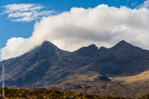 The Isle of Skye  connected to Scotland s north-west coast by a bridge  is characterised by its rugged landscape. This photo shows panoramic view on a funnel-shaped mountain.