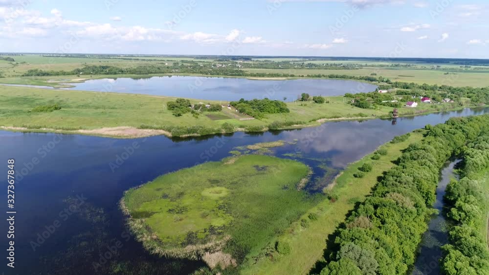 Flying on a drone over a beautiful pond in the countryside, Russia Flying on a drone over a beautiful pond in the countryside, Russia