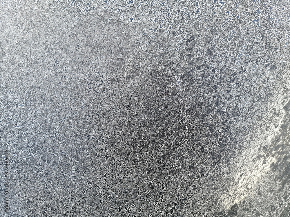 Fototapeta premium natural winter background and texture of white snow on a dark surface outdoors closeup