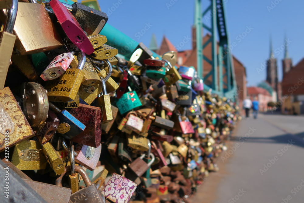 Ancient bridge with love colorful locks decoration