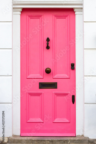 Stylish pink wooden front door