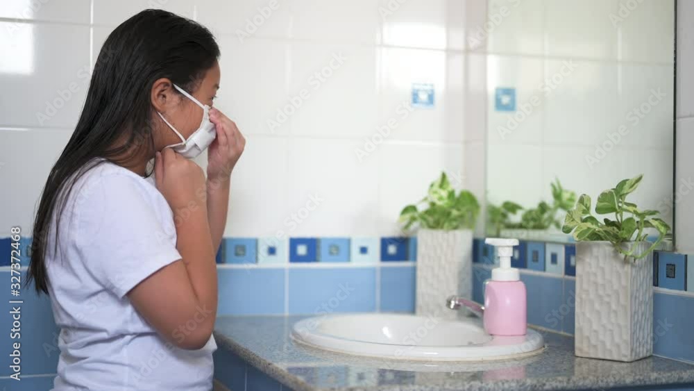 Asian girl kid wearing anti virus mask and wash hand prevent and protect from covid-19 Asian girl kid wearing anti virus mask and wash hand prevent and protect from covid-19
