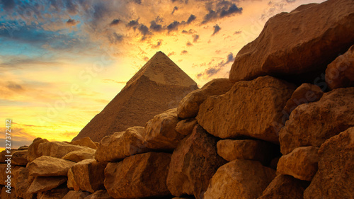 Obraz na płótnie The Chephren pyramid behind a historic stone wall at Giza in Egypt w salonie