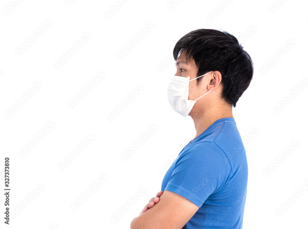 Asian young man in blue t-shirt top and medical mask to protect COVID-19 with isolated on white background concept.