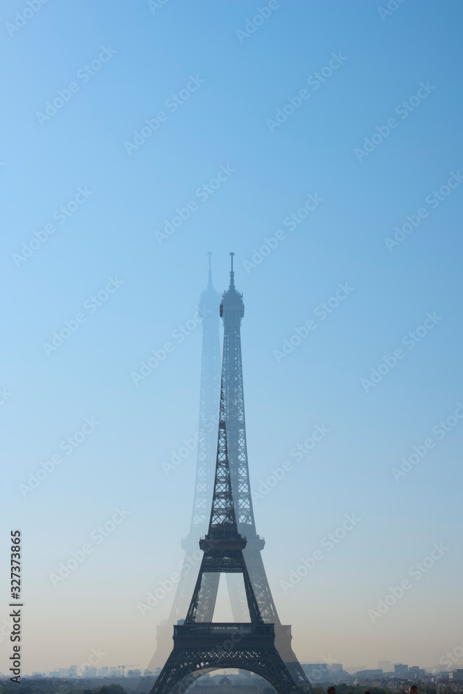 Travel concept. Eiffel Tower in Paris, France, tourism in Europe. Top Destinations in Europe. Blurred tower in the camera lens.