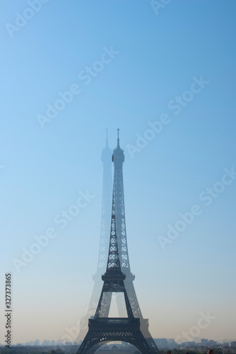 Fototapeta Naklejka Na Ścianę i Meble -  Travel concept. Eiffel Tower in Paris, France, tourism in Europe. Top Destinations in Europe. Blurred tower in the camera lens.
