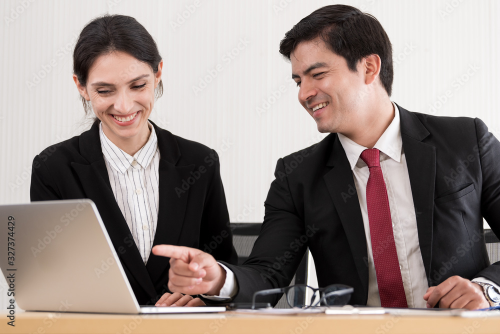A manager and secretary working together in the office. A manager and secretary working together in the office.