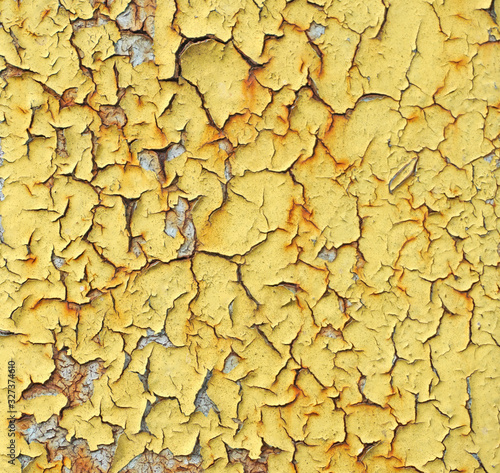 Close-up detail of cracked yellow paint