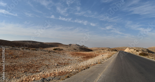 Straight road in the desertic landscape of Mount Lebanon in summer  Faraya  Lebanon