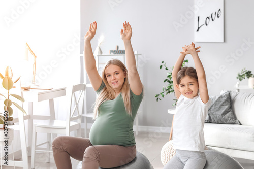 Pregnant woman and her litt...