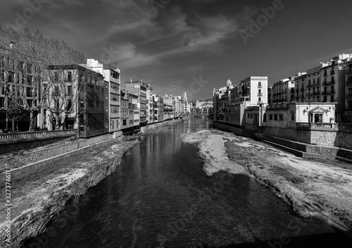 View of the old city of Girona from the bridge over the Onyar River. Catalonia. Spain. Black and white