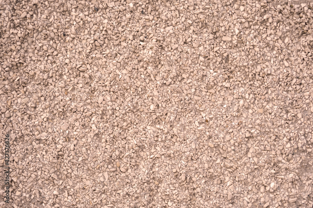 The texture of the wall is made of concrete and stone chips. Part of the structure. The texture of the wall is made of concrete and stone chips. Part of the structure.