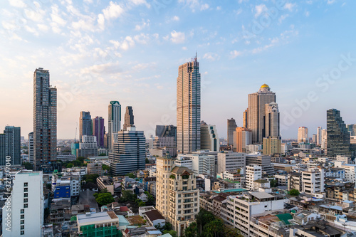 Aerial cityscape of picturesque Bangkok at sunset from rooftop. Panoramic sunrise skyline of the biggest city in Thailand. The concept of metropolis. © VideoFlow