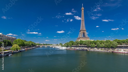 The Eiffel tower timelapse from bridge over the river Seine in Paris