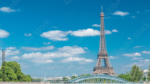 Photography Eiffel tower at the river Seine timelapse from bridge in Paris, France