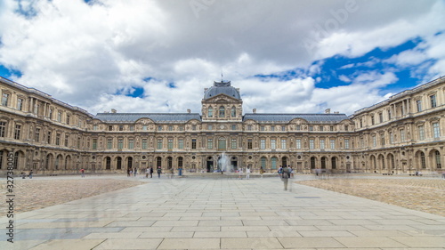 Fotografie inner yard of louvre with fountain timelapse . Paris, France